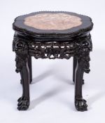A Chinese carved hardwood jardiniere stand:, of lobed circular form,