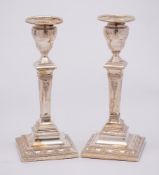A pair Edward VII silver candlesticks, maker Thomas A Scott, Sheffield 1902: in neo-classical style,