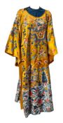 A Chinese Imperial yellow silk court robe: heavily embroidered with dragons,