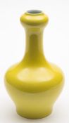 A Chinese porcelain garlic-necked vase:under a bright yellow glaze,