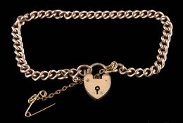 A 9ct gold curb-link bracelet: with attached heart-shaped padlock clasp,