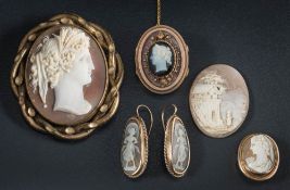 An oval cameo locket brooch,: two other cameo brooches, a pair of cameo earrings and a loose cameo.