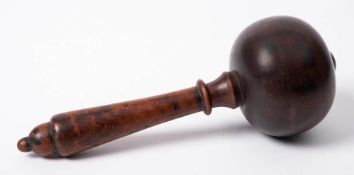 A turned hardwood mallet: the circular head with turned domed pommel,