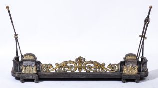 A 19th Century Coalbrookdale steel and brass fender:, of rectangular shape with rounded corners,