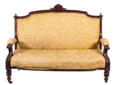 A Victorian carved mahogany settee:,
