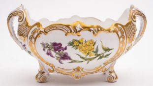 A Spode botanical bone china centrepiece: of two-handled oval form on scroll feet,