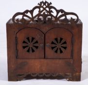 A 19th Century French stained beech bird box:, with shaped pierced fret cresting,