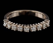 An 18ct white gold and diamond half hoop ring: set with round,