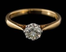 A diamond solitaire ring: the round, brilliant-cut diamond approximately 5.6mm diameter x 3.