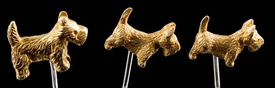 Three 9ct gold 'Scottie Dog' motif pins: all stamped C & F, approximately 14gms gross weight.