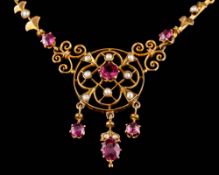 A pink gem-set and seed pearl necklace: of open work design suspending three gem-set drops,