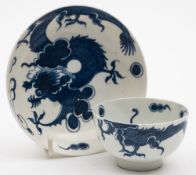 A Lowestoft blue and white dragon pattern teabowl and saucer: each piece painted in rich underglaze