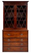 An early 19th Century mahogany secretaire chest and associated bookcase:,