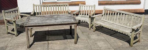 A weathered teak suite of garden dining furniture:, comprising a rectangular table,