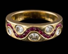 An 18ct gold, diamond and garnet-set band: set with five, oval rubies and small, circular garnets,