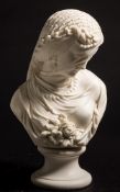 A Robinson and Leadbeater parian bust of a veiled girl: looking demurely downwards with eyes closed,