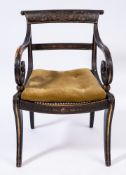A Regency ebonised and decorated elbow chair:,