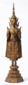 A Burmese 'shan' style gilt bronze figure of a standing, crowned and jeweled Buddha,