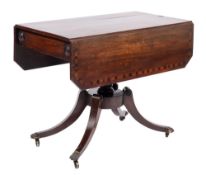A Regency mahogany and inlaid drop flap breakfast table:, bordered with ebony lines,