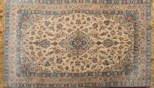 An Isfahan rug:, the ivory cartouche field with a central lozenge pole medallion,