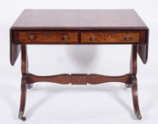 A Regency mahogany and inlaid sofa table:, bordered with ebonised lines,