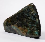 A large polished Labradorite boulder specimen: with rich greens and blues,
