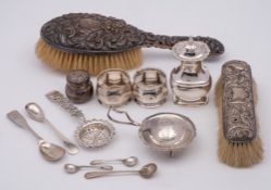 A mixed lot of silver wares including:- two silver-backed brushes, silver napkin rings, pepperettes,