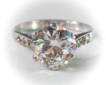 A diamond single-stone ring: the round old brilliant-cut diamond approximately 9.5mm diameter x 5.