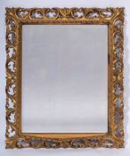 A carved giltwood rectangular mirror:,