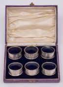 A set of six George V silver napkin rings, maker Joseph Gloster Ltd, Birmingham, 1928: numbered 1-6,