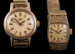 A lady's 9ct gold Omega wristwatch: the dial with baton markers, Omega crown,