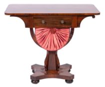 A Victorian rosewood work table:, the rectangular top with rounded corners,