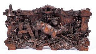 A 19th Century Black Forest lindenwood carved relief panel:,