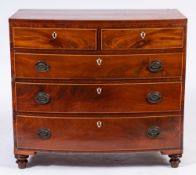 An early 19th Century mahogany and inlaid bow-fronted chest:, bordered with boxwood and ebony lines,