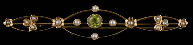 An Edwardian peridot and seed pearl bar brooch: approximately 63mm long, 4gms gross weight,