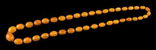 An amber bead single-string necklace: comprising forty individually knotted oblong beads,
