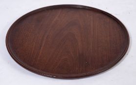 A Georgian mahogany circular tray:, 51cm (1ft 8in) diameter.