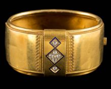 An 18ct gold, diamond and enamelled Etruscan-style bangle: set with cushion-shaped,