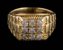 A gentleman's white stone-set ring: stamped '750': approximately 12gms gross weight.