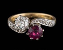 An early 20th century ruby and diamond cross-over ring: the round ruby approximately 5.
