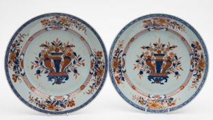 A pair of Chinese Imari dishes: each painted in underglaze blue,