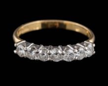 An 18ct gold and diamond half-hoop ring: set with round,