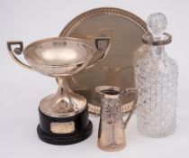 A white metal twin-handled trophy cup,