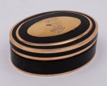 A gold mounted tortoiseshell oval box: the hinged lid with crest of stag beneath a tree,