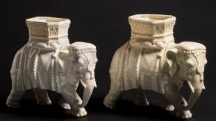 Two Royal Worcester elephant vases modelled by James Hadley: in the white,