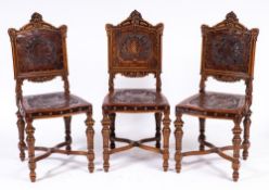 A set of six 19th Century Italian carved walnut dining chairs:,