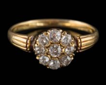 A Georgian circular diamond cluster ring: the round old brilliant-cut diamonds estimated to weigh a