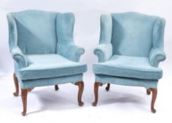 A pair of 19th Century French carved beech wing frame armchairs:,