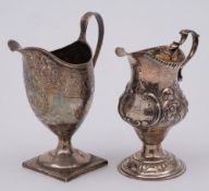 A George III cream jug, all marks worn maker possibly RE or RF: monogrammed,