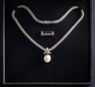 A cultured pearl and diamond mounted pendant: the cultured pearl believed to be South Sea